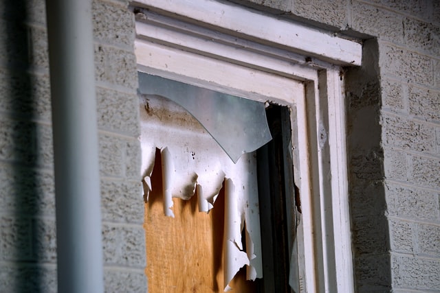 boarded up window needs Baytown residential glass repair