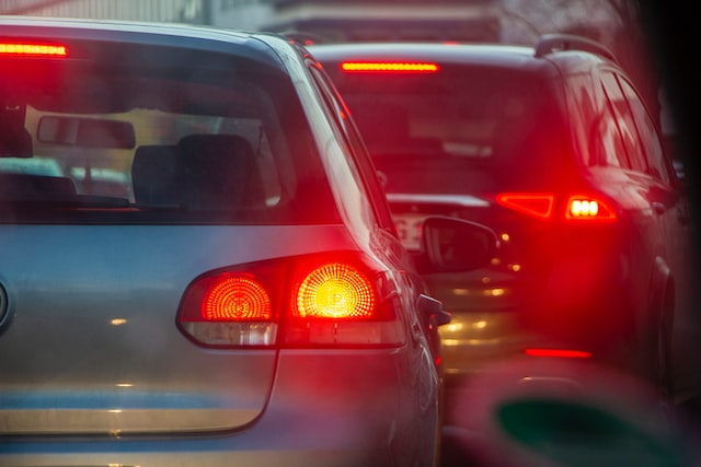 Cars in traffic that need auto glass repair in Baytown for rear windshield damage.