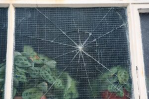 Damaged window that needs glass repair in Dayton, TX