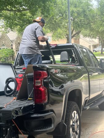 A Joey's Glass trusted technician provides mobile auto glass replacement in Baytown, TX, on a truck.